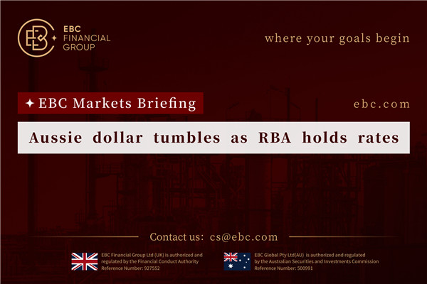 Aussie dollar tumbles as RBA holds rates
